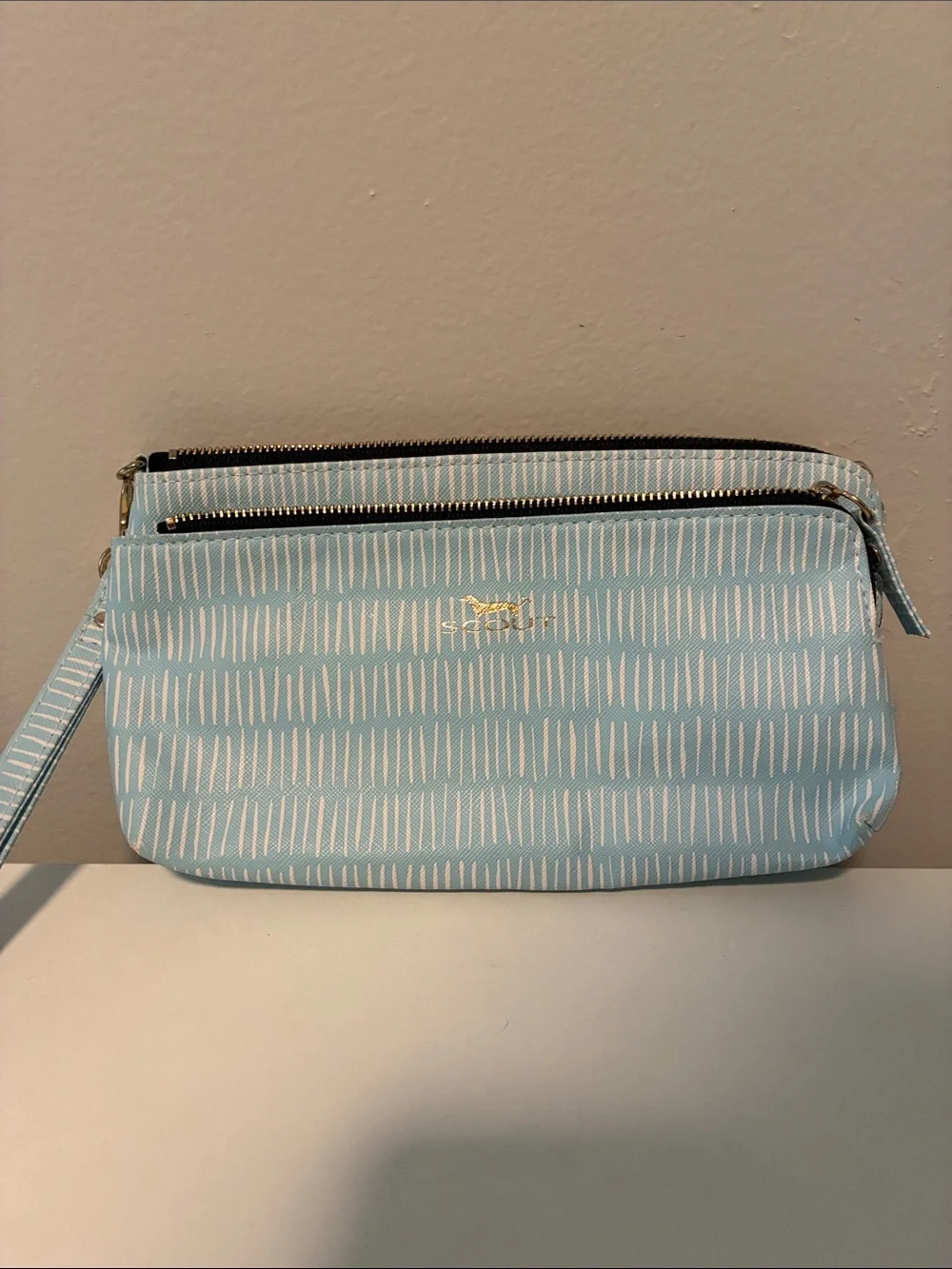 Scout Light Blue Patterned Wristlet with Gold Logo